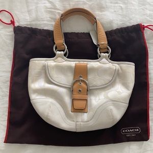 Coach satchel. White and silver. With original garment bag.